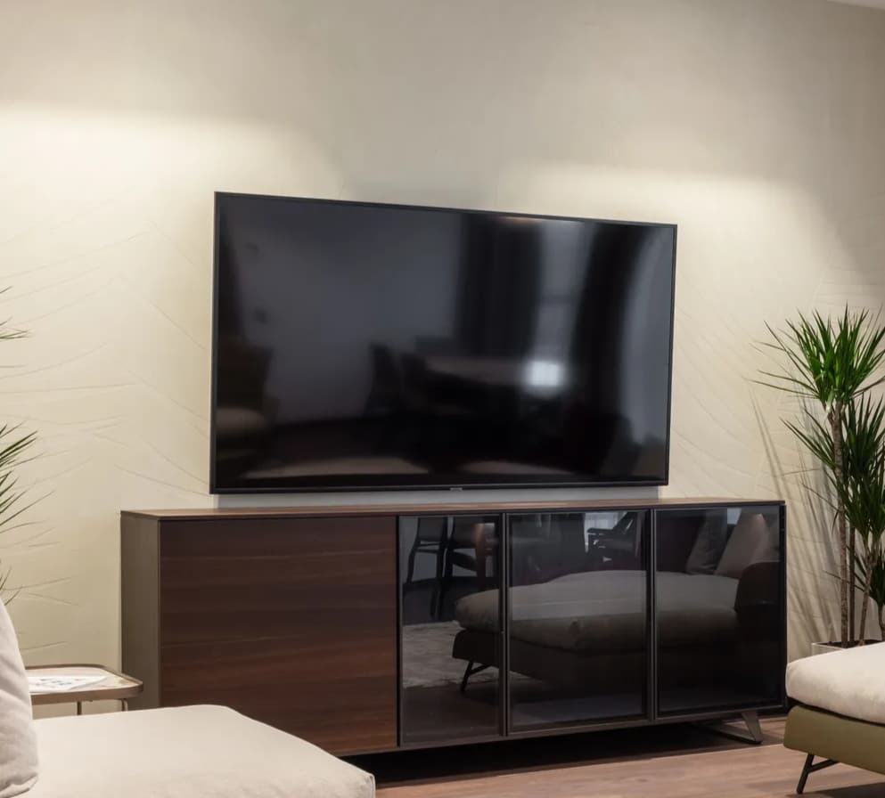 Flat-screen television on a media stand in a living room