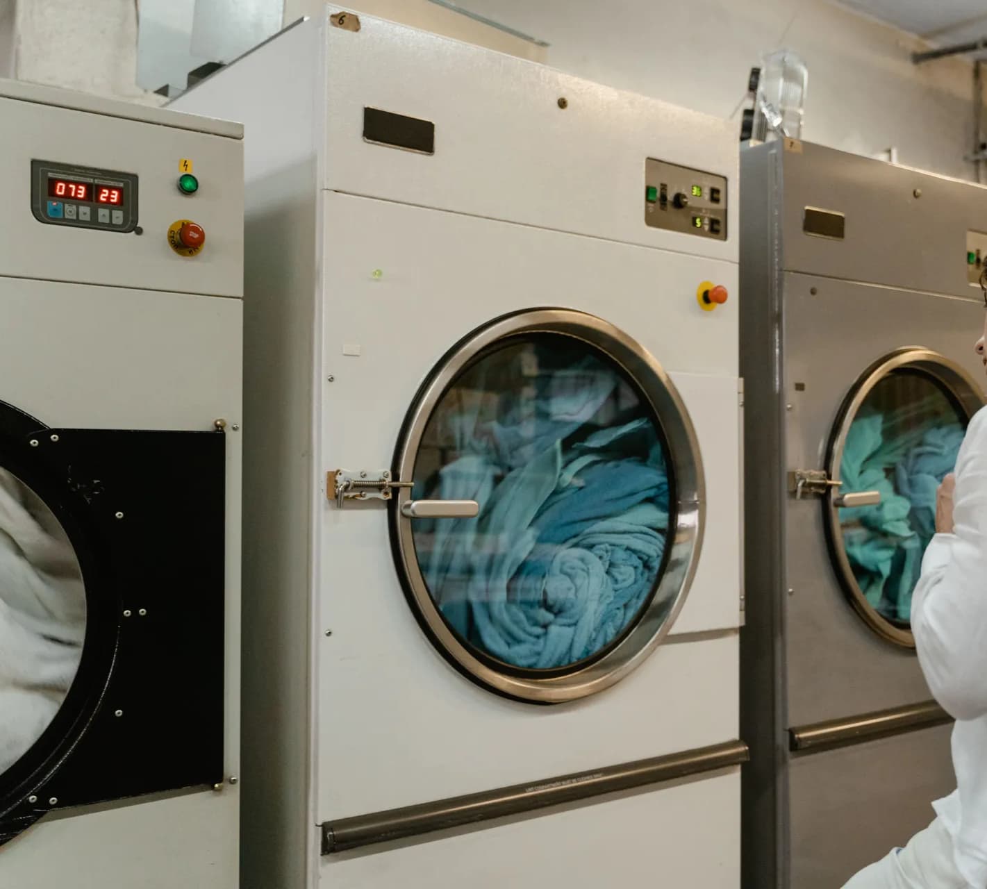 Front-loading washing machine with a round glass door