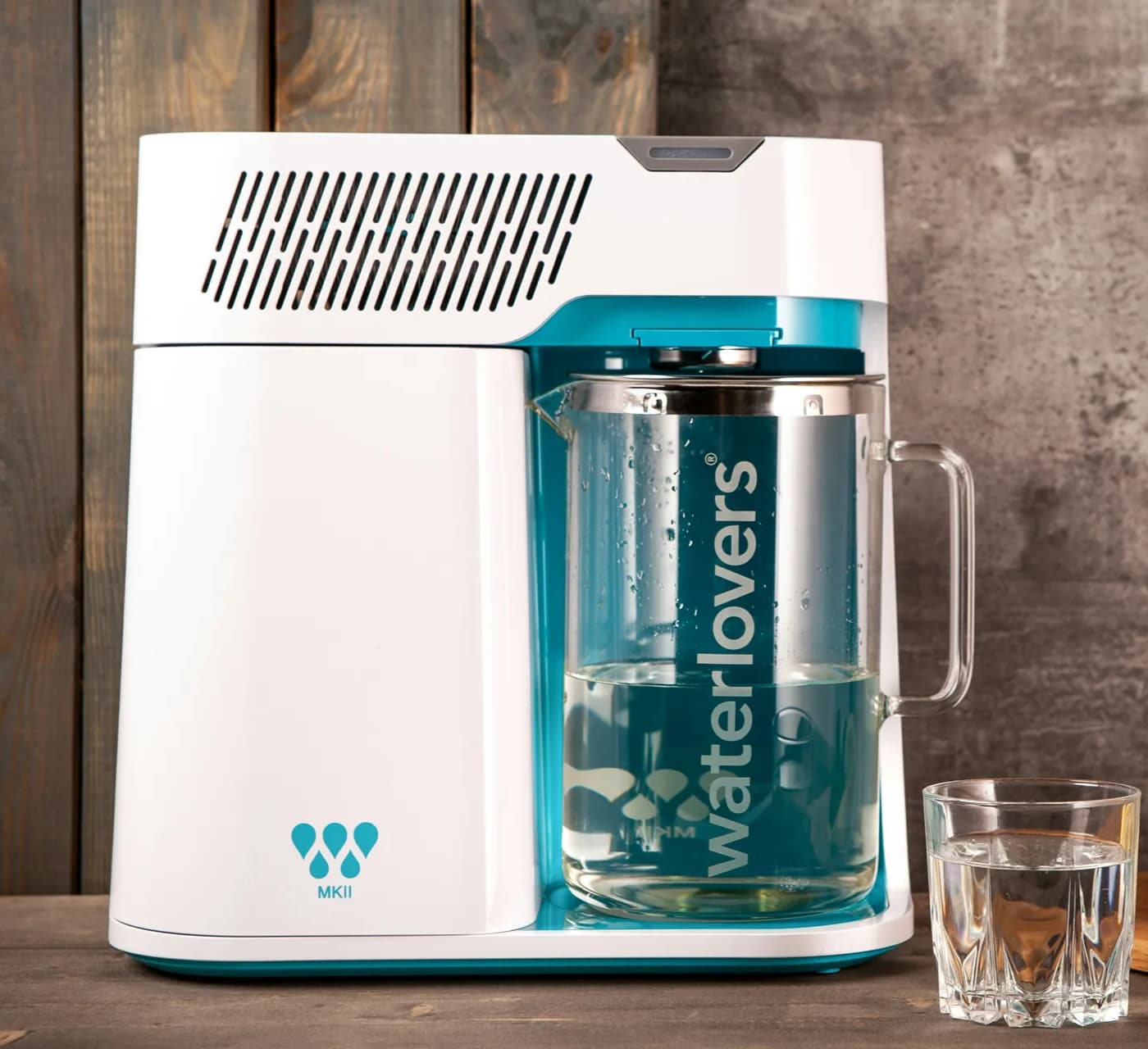 Countertop water purifier with a glass jug inserted into it